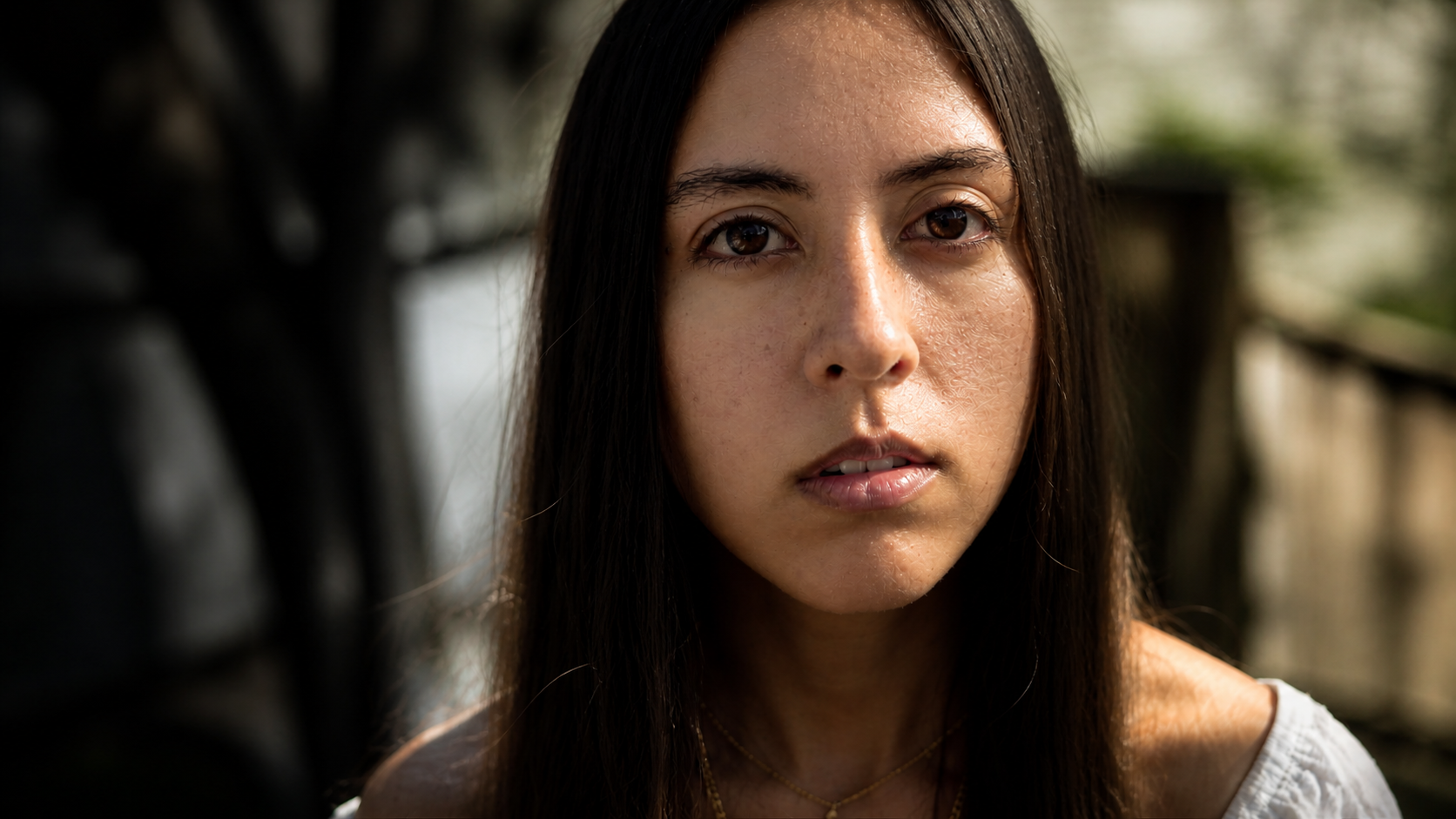 cinematic close up woman direct eye contact awakening introspective moment natural lighting